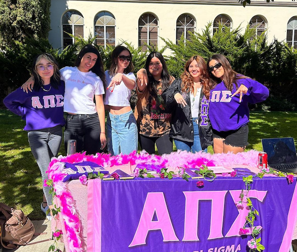 group of students at a sign up table